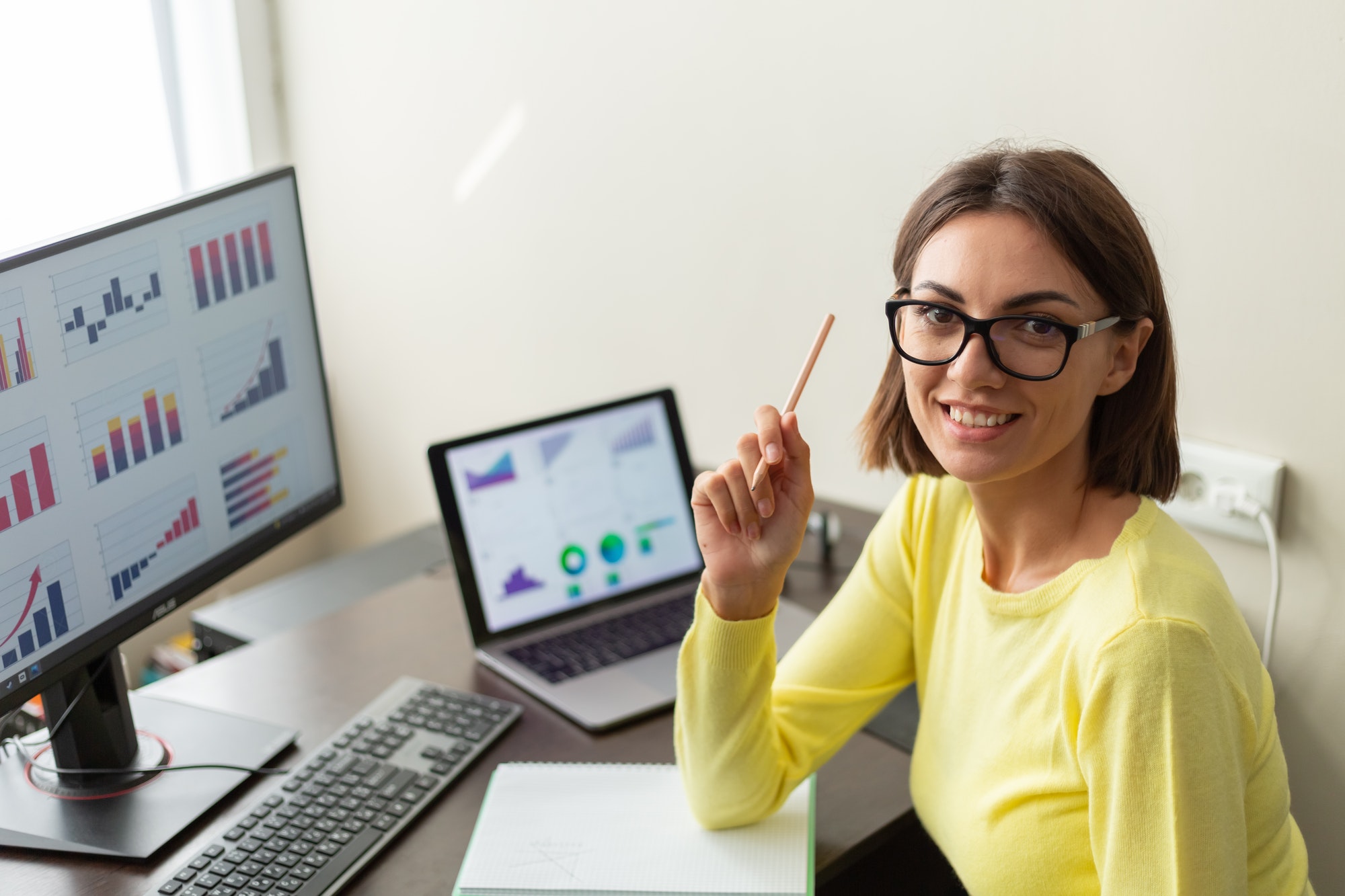 Caucasian advisor financial business analytics woman with data dashboard graphs